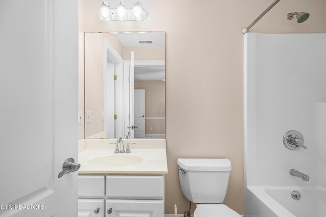 full bathroom featuring vanity, toilet, and bathtub / shower combination