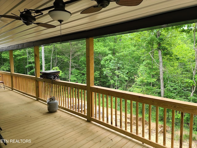 wooden terrace featuring ceiling fan