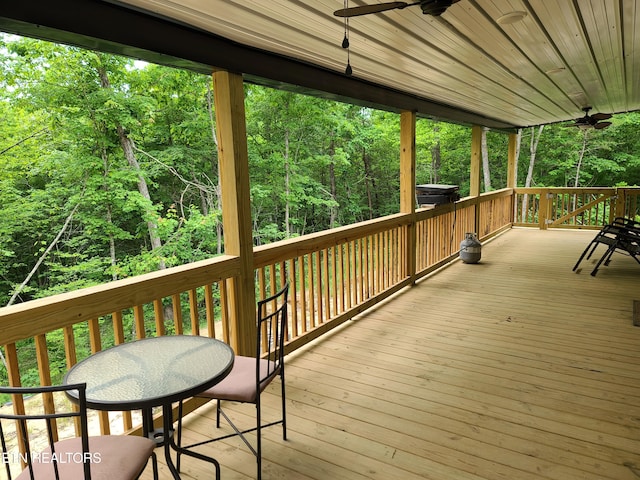 wooden terrace featuring ceiling fan