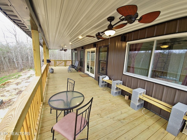 wooden terrace featuring ceiling fan