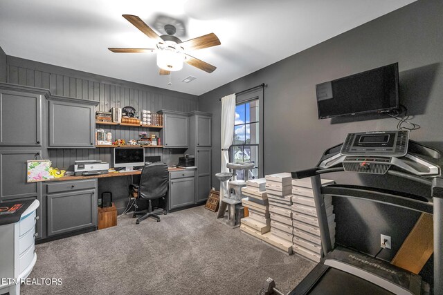 office area featuring dark carpet and ceiling fan