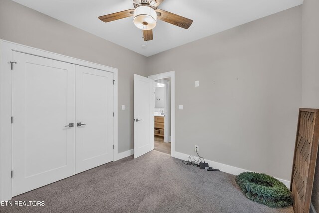 bedroom featuring ceiling fan, a closet, and carpet flooring