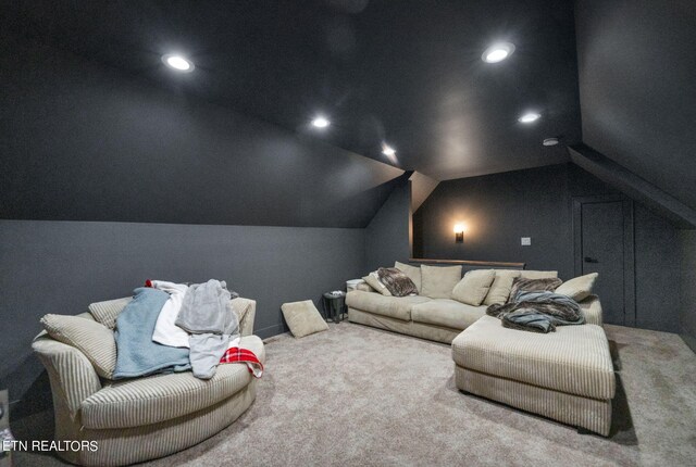 home theater with carpet flooring and vaulted ceiling