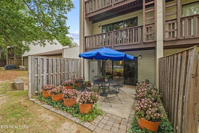 view of patio with a balcony