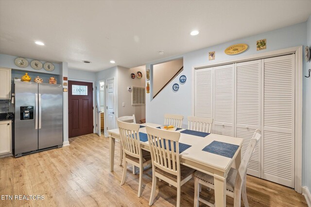 dining room with light hardwood / wood-style flooring