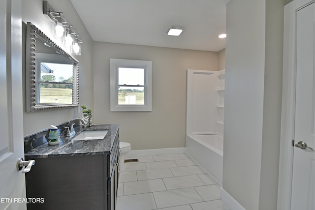 full bathroom featuring a healthy amount of sunlight, tile patterned flooring, vanity, and toilet