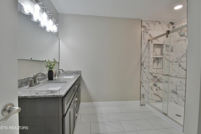 bathroom featuring an enclosed shower and vanity