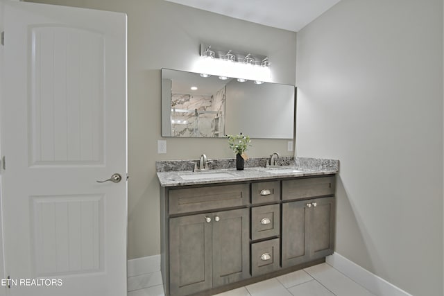 bathroom with tile patterned flooring and vanity