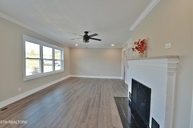 unfurnished living room with ceiling fan, dark hardwood / wood-style floors, and crown molding