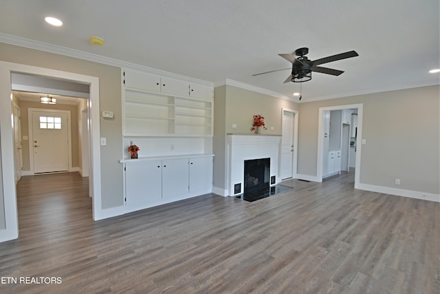 unfurnished living room with ornamental molding, ceiling fan, and hardwood / wood-style flooring