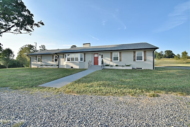 ranch-style house with a front lawn