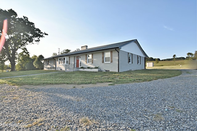 ranch-style home with a front yard