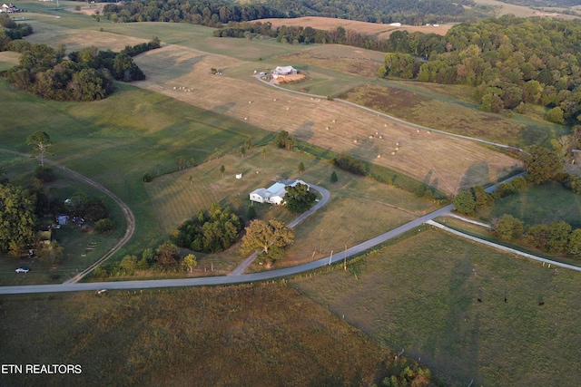 birds eye view of property with a rural view