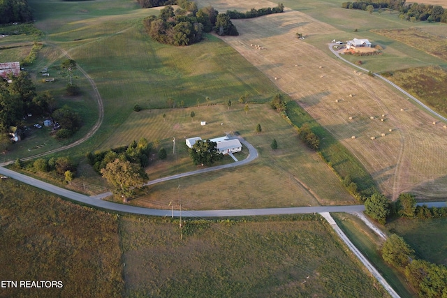 birds eye view of property with a rural view