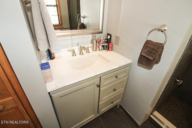 bathroom with vanity and tile patterned floors