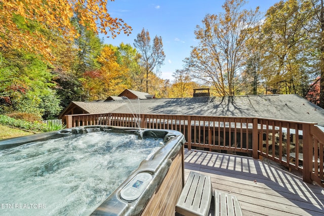 wooden terrace with a hot tub