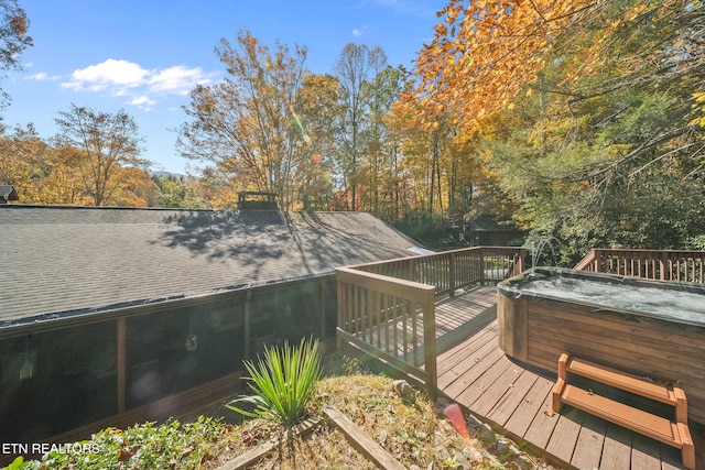 wooden terrace featuring a hot tub