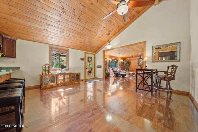 interior space with hardwood / wood-style flooring, ceiling fan, wood ceiling, and high vaulted ceiling