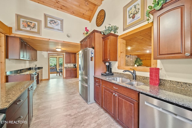 kitchen featuring light stone counters, stainless steel appliances, vaulted ceiling, sink, and wooden ceiling