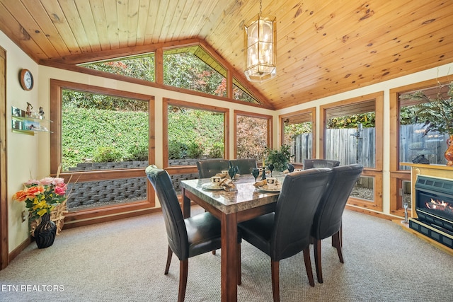 carpeted dining area with a chandelier, vaulted ceiling, and wooden ceiling