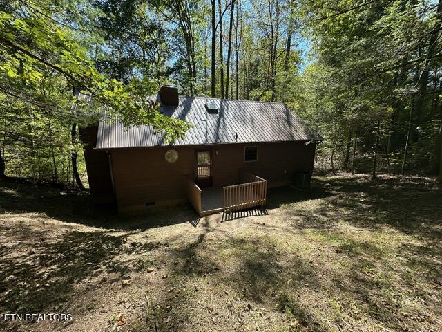230 Penni Ln, Townsend, TN 37882 - view of home's exterior with crawl space, metal roof, and a chimney