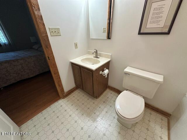 bathroom featuring vanity and toilet