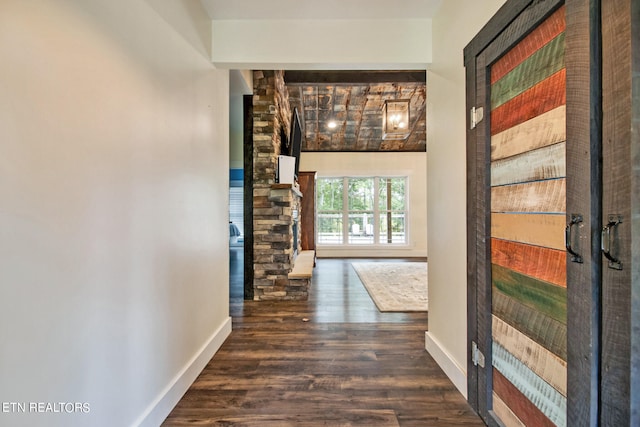 corridor with dark hardwood / wood-style floors