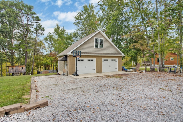 view of property exterior with a yard and a garage