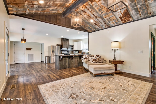 living room with vaulted ceiling with beams and dark hardwood / wood-style floors