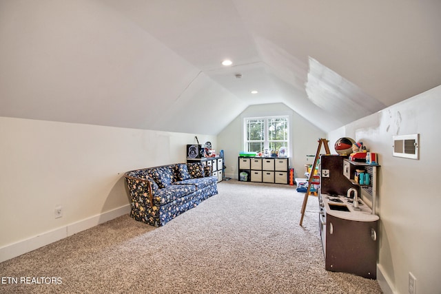 living area featuring carpet floors and vaulted ceiling