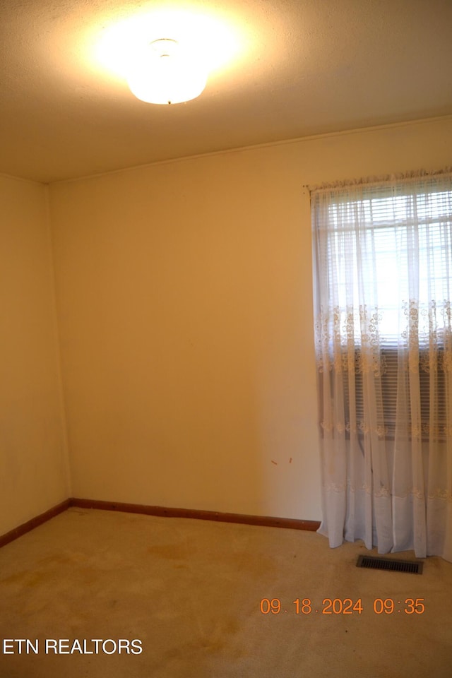 empty room featuring carpet flooring