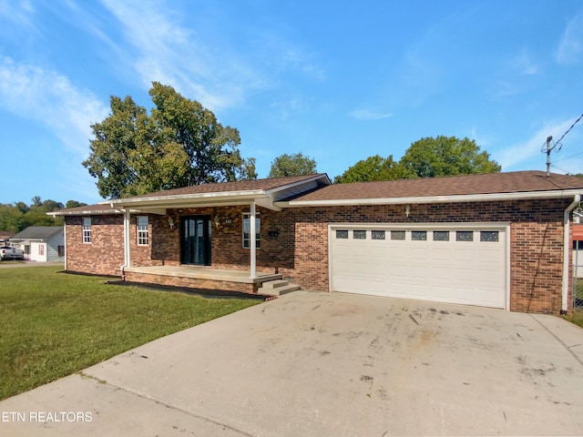 single story home with a front yard and a garage