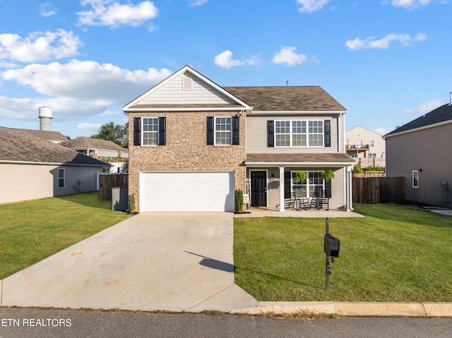 front of property featuring cooling unit, covered porch, a front yard, and a garage