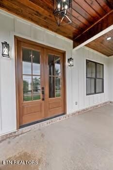 property entrance featuring french doors