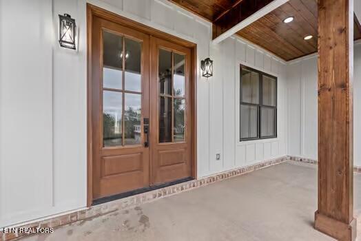 property entrance featuring french doors