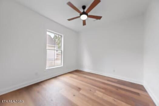 spare room featuring ceiling fan and wood-type flooring