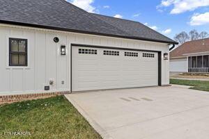 exterior space with an outbuilding and a garage