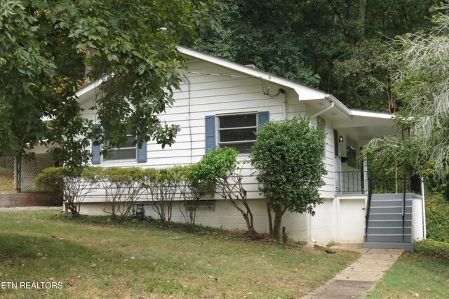 view of home's exterior featuring a lawn