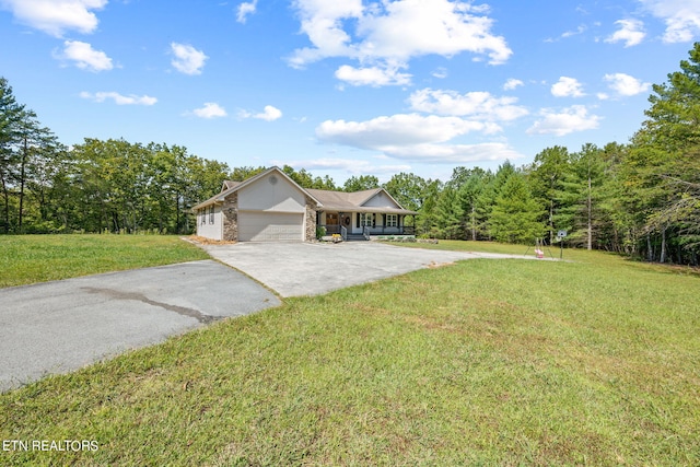 single story home featuring a front yard and a garage