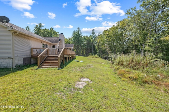 view of yard featuring a wooden deck