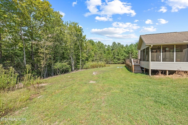 view of yard featuring a sunroom