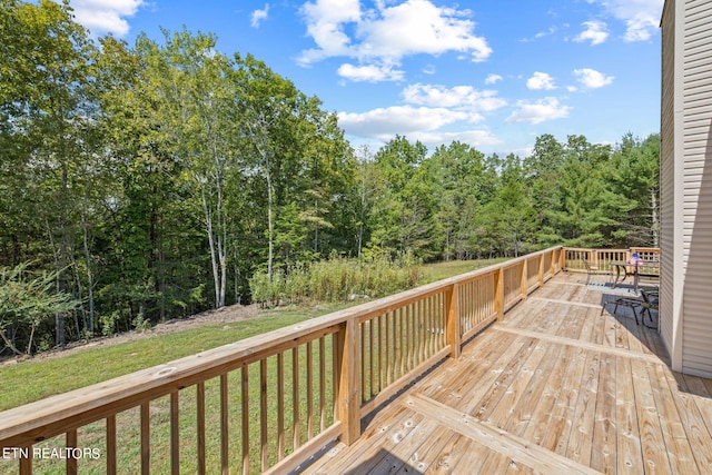 deck featuring a lawn