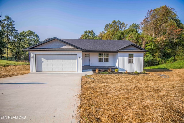 ranch-style home featuring a garage