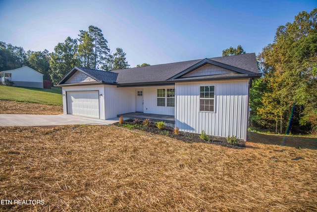 ranch-style house with a front yard and a garage