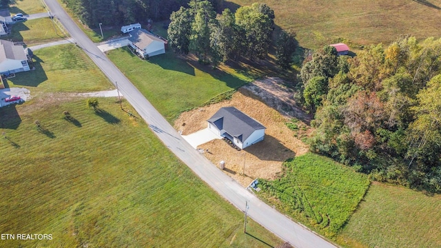 birds eye view of property featuring a rural view