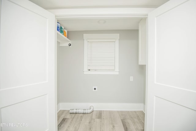 washroom with laundry area, baseboards, light wood-style floors, and hookup for an electric dryer