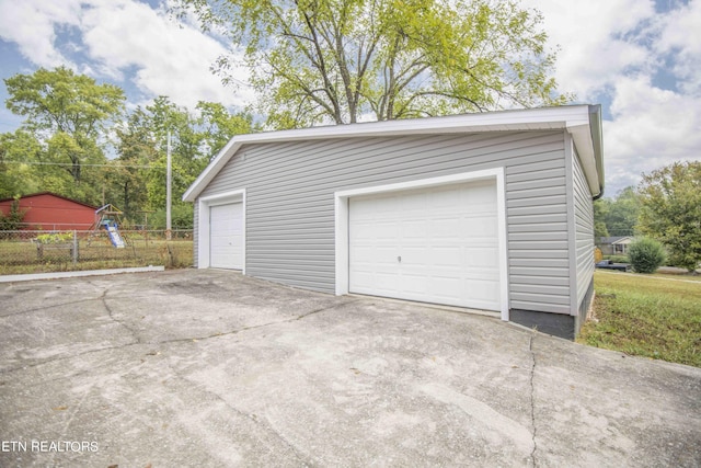 garage featuring fence