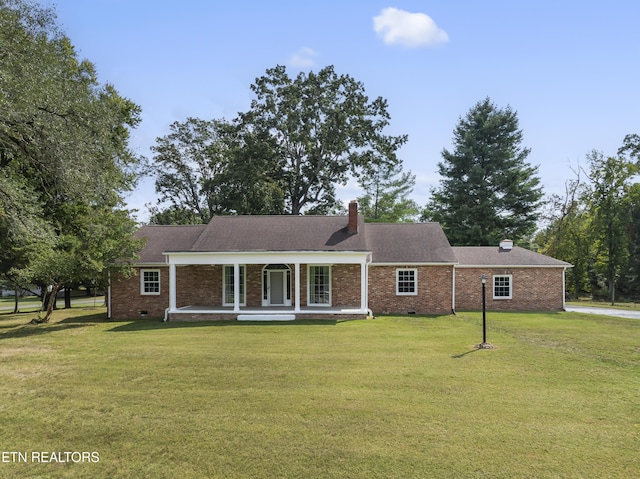 ranch-style home with a porch and a front lawn