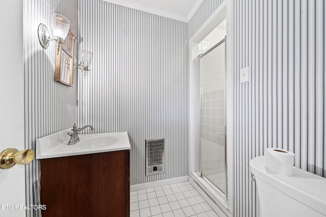 bathroom featuring vanity, heating unit, a shower with door, crown molding, and toilet