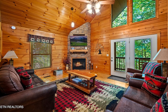 living room with a healthy amount of sunlight, ceiling fan, and hardwood / wood-style flooring